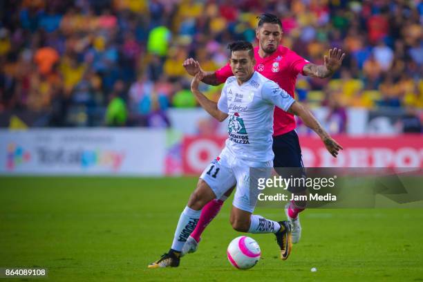 Andres Andrade of Leon and Rodrigo Millar of Morelia fight for the ball during the 14th round match between Morelia and Leon as part of the Torneo...