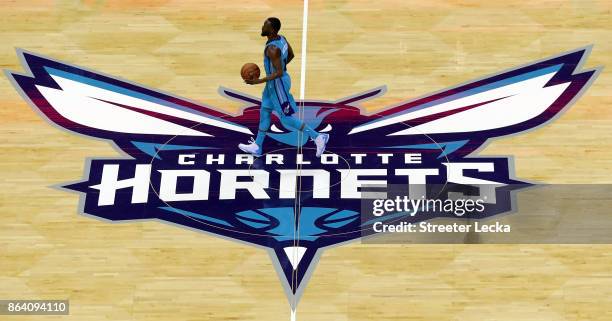 Kemba Walker of the Charlotte Hornets brings the ball up against the Atlanta Hawks during their game at Spectrum Center on October 20, 2017 in...