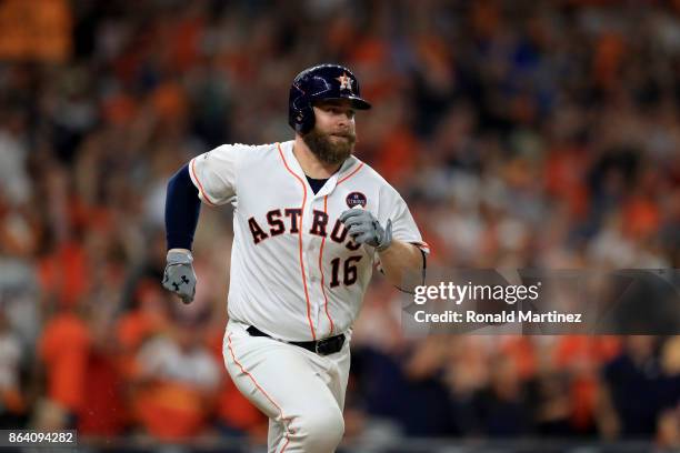 Brian McCann of the Houston Astros runs after hitting an RBI double to score Alex Bregman against Luis Severino of the New York Yankees during the...