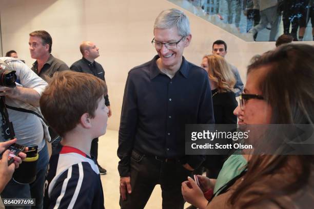 Apple CEO Tim Cook greets guests at the grand opening of Apple's Chicago flagship store on Michigan Avenue October 20, 2017 in Chicago, Illinois. The...