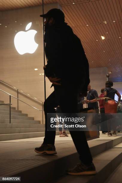 Guests attend the grand opening of Apple's Chicago flagship store along Michigan Avenue on October 20, 2017 in Chicago, Illinois. The glass-sided...