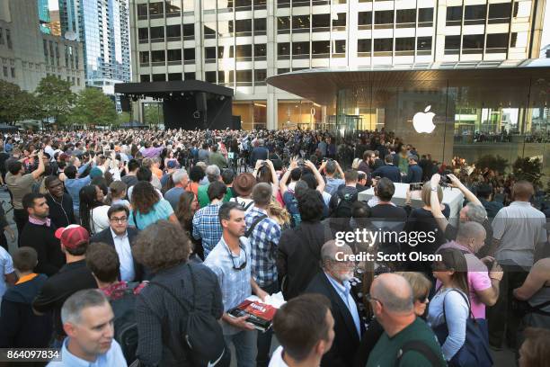 Guests attend the grand opening of Apple's Chicago flagship store along Michigan Avenue on October 20, 2017 in Chicago, Illinois. The glass-sided...