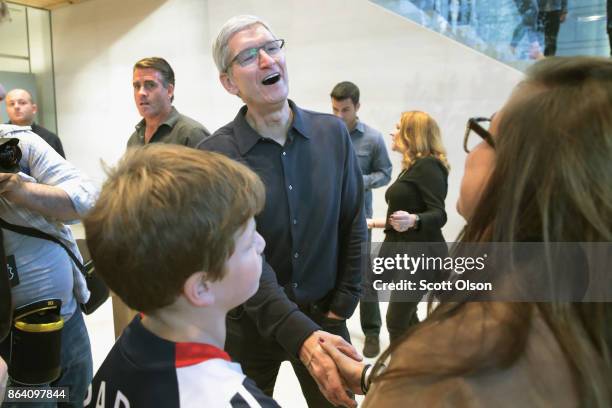 Apple CEO Tim Cook greets guests at the grand opening of Apple's Chicago flagship store on Michigan Avenue October 20, 2017 in Chicago, Illinois. The...