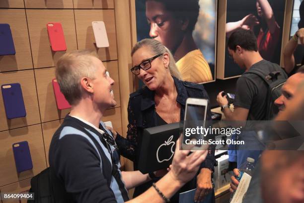 Angela Ahrendts, Apples senior vice president of Retail, speaks to guests during the grand opening of Apple's newest store located on Michigan Avenue...