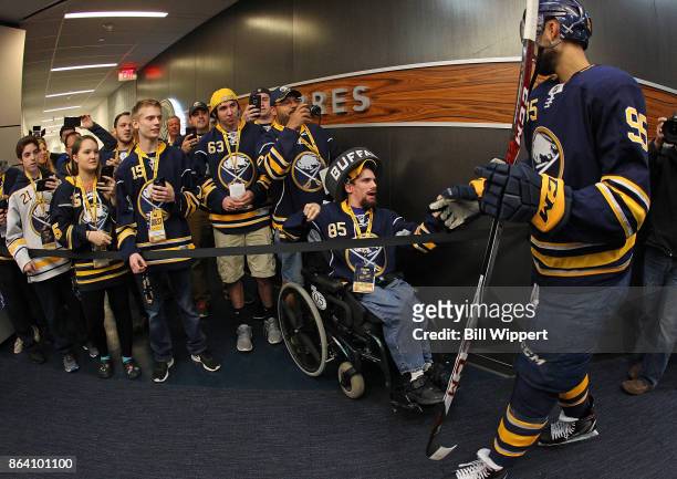 Justin Bailey of the Buffalo Sabres greets fans as he heads to the ice during an NHL game against the Vancouver Canucks on October 20, 2017 at...