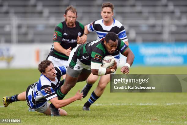 Vatiliai Tora of South Canterbury is tackled by Ethan Robinson of Wanganui during the Heartland Championship Semi Final match between South...