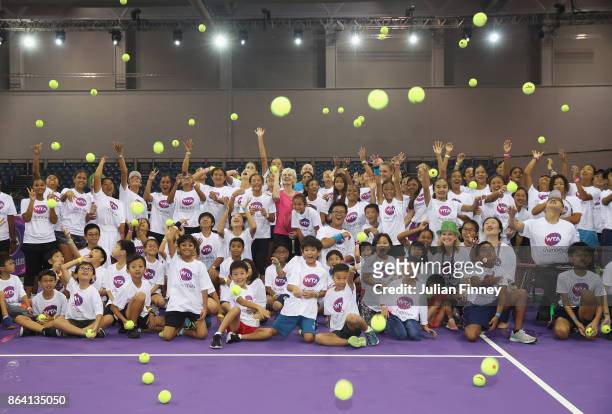 Judy Murray poses with children during Community Day prior to the BNP Paribas WTA Finals Singapore presented by SC Global at OCBC Arena on October...
