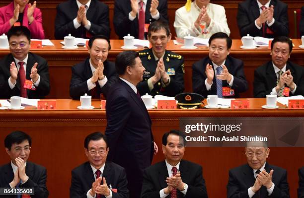 Chinese President Xi Jinping walks after delivering his speech during the opening session of the 19th Communist Party Congress held at the Great Hall...
