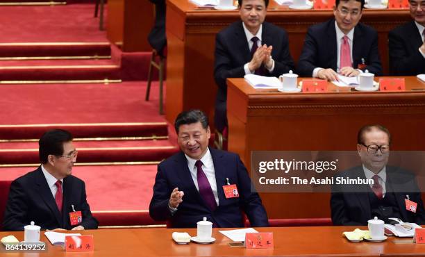 Chinese President Xi Jinping former presidents Hu Jintao and Jiang Zemin attend during the opening session of the 19th Communist Party Congress held...