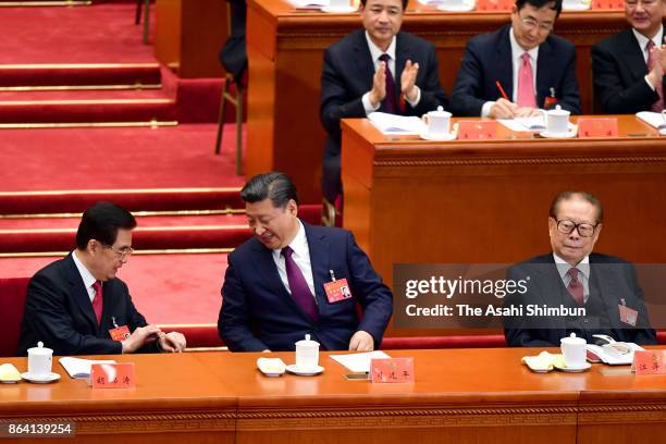 Chinese President Xi Jinping former presidents Hu Jintao and Jiang Zemin attend during the opening session of the 19th Communist Party Congress held...