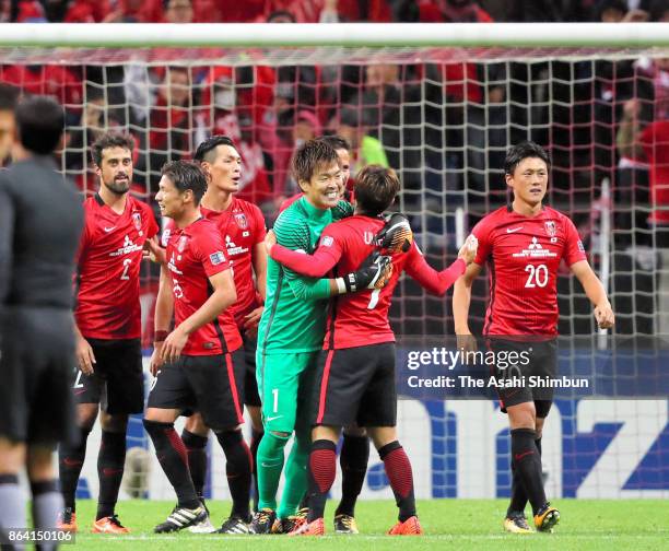 Urawa Red Diamonds players celebrate their 1-0 victory in the AFC Champions League semi final second leg match between Urawa Red Diamonds and...