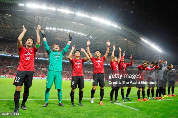 Urawa Red Diamonds players celebrate their 1-0 victory in the AFC Champions League semi final second leg match between Urawa Red Diamonds and...