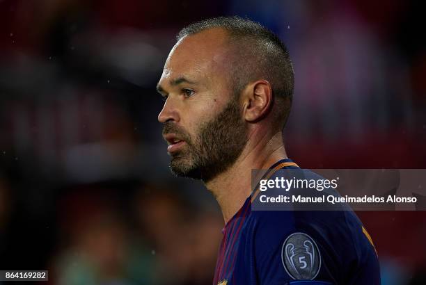 Andres Iniesta of Barcelona looks on during the UEFA Champions League group D match between FC Barcelona and Olympiakos Piraeus at Camp Nou on...