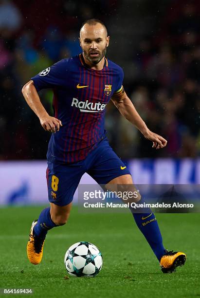 Andres Iniesta of Barcelona runs with the ball during the UEFA Champions League group D match between FC Barcelona and Olympiakos Piraeus at Camp Nou...