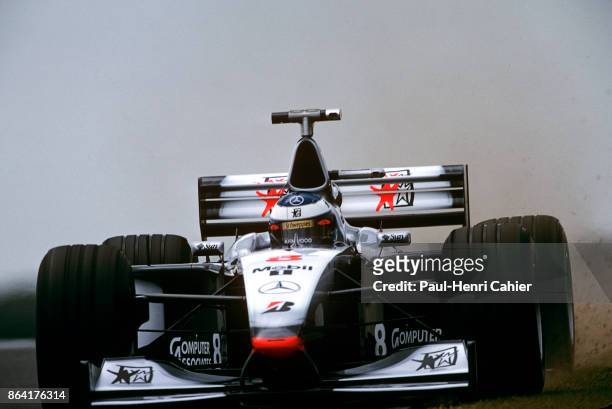 Mika Häkkinen, McLaren-Mercedes MP4-13, Grand Prix of Great Britain, Silverstone Circuit, 12 July 1998. Mika Häkkinen running wide into the gravel in...