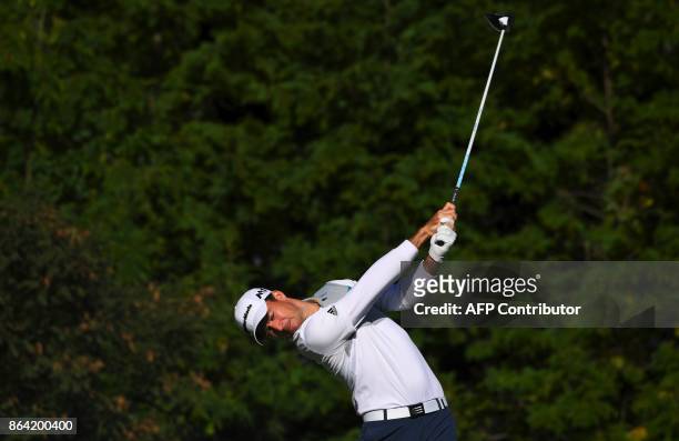 Nick Taylor of Canada tees off on the 3rd hole during the third round of the CJ Cup at Nine Bridges in Jeju Island on October 21, 2017. / AFP PHOTO /...