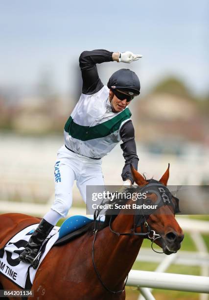 Jockey Cory Parish riding Boom Time celebrates as he wins race 8 The BMW Caulfield Cup during Caulfield Cup Day at Caulfield Racecourse on October...