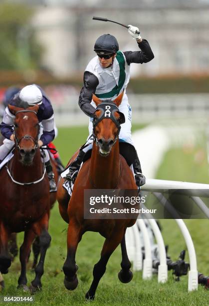 Jockey Cory Parish riding Boom Time celebrates as he wins race 8 The BMW Caulfield Cup during Caulfield Cup Day at Caulfield Racecourse on October...