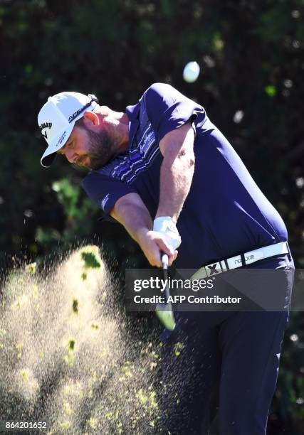 Marc Leishman of Australia tees off on the 7th hole during the third round of the CJ Cup at Nine Bridges in Jeju Island on October 21, 2017. / AFP...