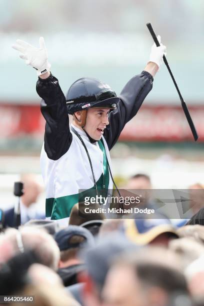 Boom Time ridden by Cory Parish celebrates after he wins the BMW Caulfield Cup during Melbourne Racing at Caulfield Racecourse on October 21, 2017 in...