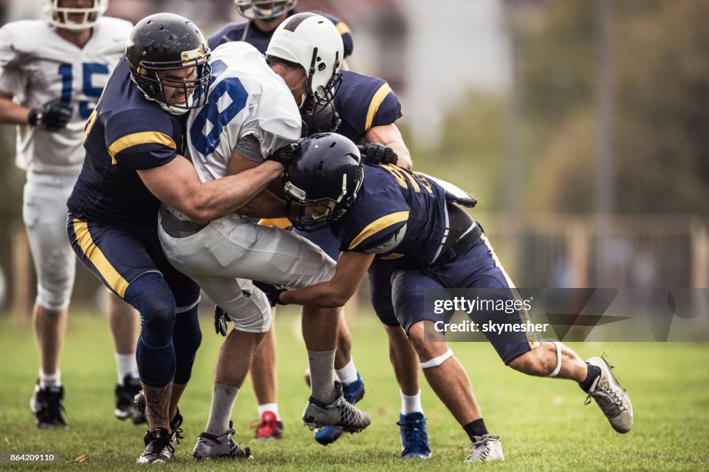Blocking an offensive player on American football match!