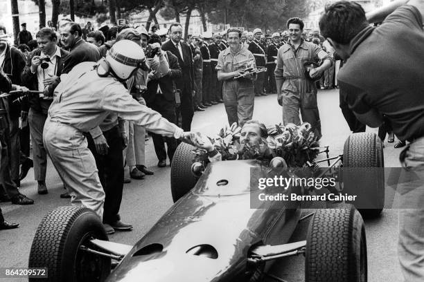 Graham Hill, Jackie Stewart, BRM P261, Grand Prix of Monaco, Circuit de Monaco, 30 May 1965. Jackie Stewart congratulates Graham Hill on his third...