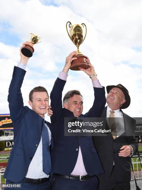 Trainers David Hayes, Tom Dabernig and Ben Hayes poses with the cup after Boom Time won Race 8, Caulfield Cup during Melbourne Racing on Caulfield...