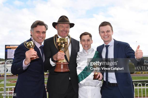 Tom Dabernig, David Hayes Cory Parish and Ben Hayes poses with the cup after Boom Time won Race 8, Caulfield Cup during Melbourne Racing on Caulfield...