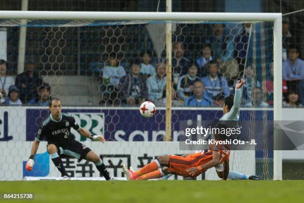 Rony of Albirex Niigata scores the opening goal during the J.League J1 match between Jubilo Iwata and Albirex Niigata at Yamaha Stadium on October...