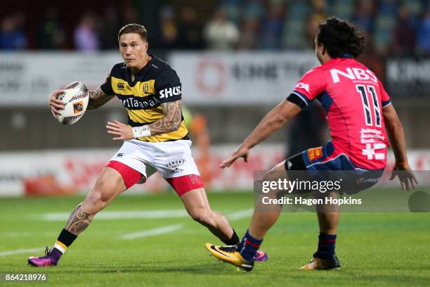 Declan O'Donnell of Taranaki attempts to evade James Lowe of Tasman during the Mitre 10 Cup Semi Final match between Taranaki and Tasman at Yarrow...