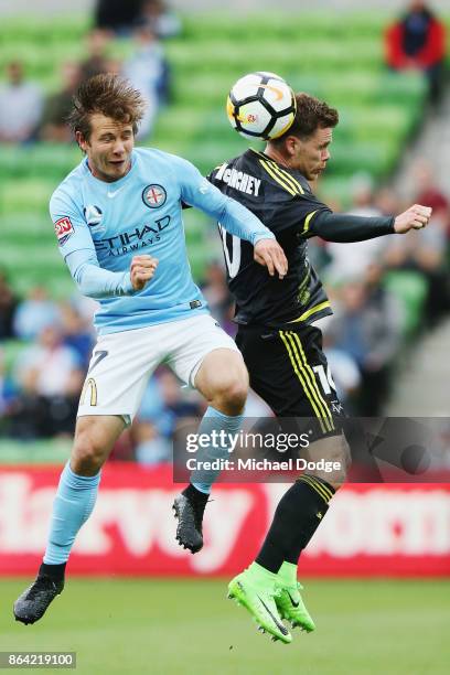 Nicholas Fitzgerald of the City and Michael McGlinchey of Wellington Phoenix compete for the ball during the round three A-League match between...