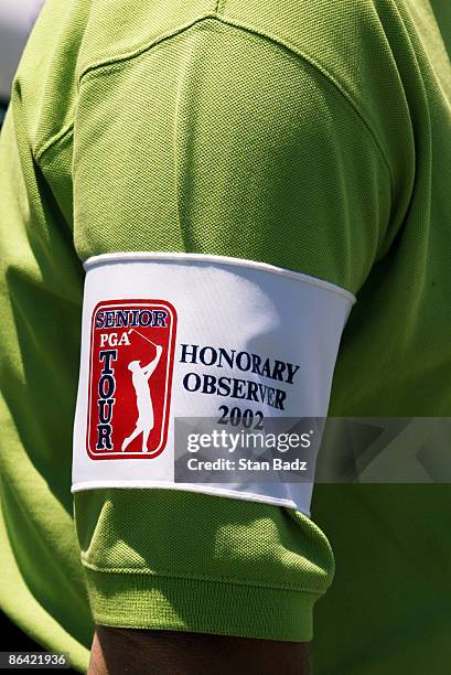 Honorary observers get ready to walk with players on Sunday at the first tee.