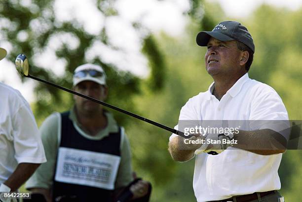 Mark McCumber watches his tee shot during Saturday's round.