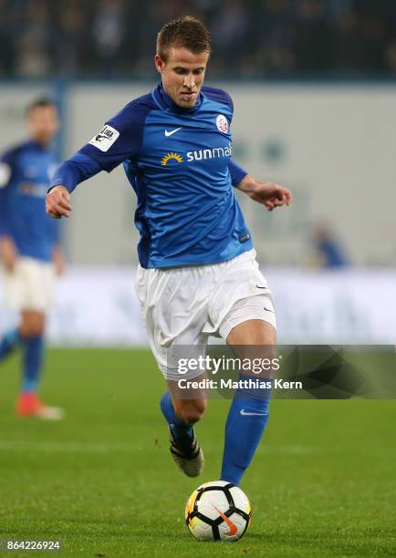 Tommy Grupe of Rostock runs with the ball during the third league match between FC Hansa Rostock and VfL Osnabrueck at Ostseestadion on October 20,...