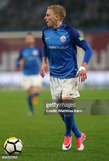 Willi Evseev of Rostock runs with the ball during the third league match between FC Hansa Rostock and VfL Osnabrueck at Ostseestadion on October 20,...