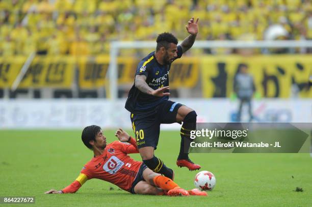 Ramon Lopes of Kashiwa Reysol is tackled by Kosuke Kikuchi of Omiya Ardija during the J.League J1 match between Omiya Ardija and Kashiwa Reysol at...