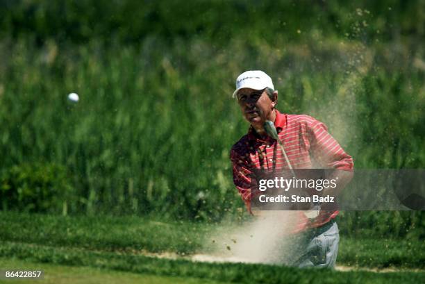 Hale Irwin punches out of the bunker on Sunday.