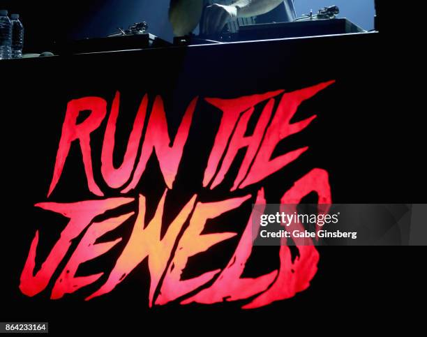 An illuminated sign for Run the Jewels is displayed on the DJ booth during the bands performance at Brooklyn Bowl Las Vegas on October 20, 2017 in...