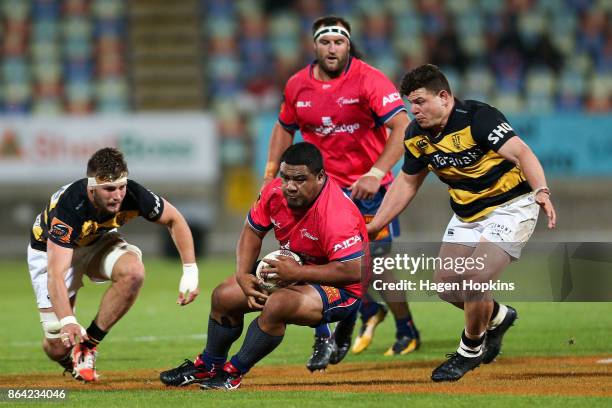 Andrew Makalio of Tasman goes to ground under pressure from Ricky Riccitelli of Taranaki during the Mitre 10 Cup Semi Final match between Taranaki...