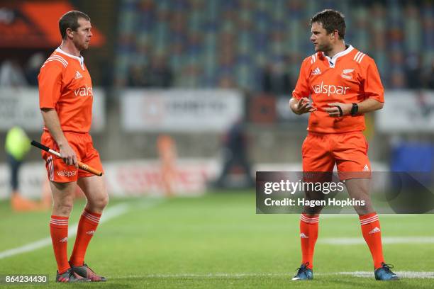 Referee Nick Briant speaks to assistant referee Jamie Nutbrown before showing Seta Tamanivalu of Taranaki a yellow card during the Mitre 10 Cup Semi...