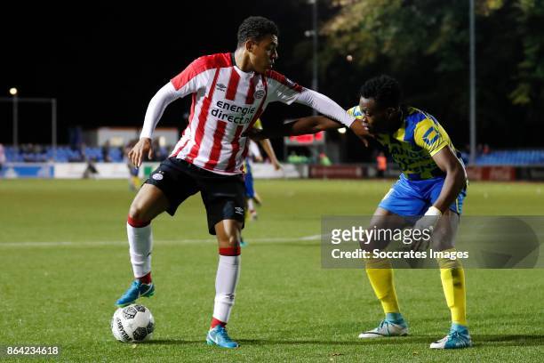 Donyell Malen of PSV U23, Gigli Ndefe of RKC Waalwijk during the Dutch Jupiler League match between PSV U23 v RKC Waalwijk at the de Herdgang on...