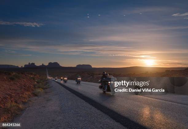 bikes on the road to monument valley - motorcycle group stock pictures, royalty-free photos & images