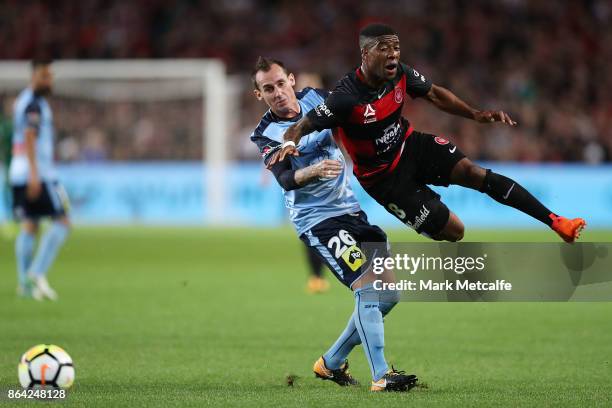 Roly Bonevacia of the Wanderers is tackled by Luke Wilkshire of Sydney FC during the round three A-League match between Sydney FC and the Western...