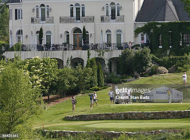 Players drive from the 18th tee box in the third and final round of the Allianz Championship held at Glen Oaks Country Club in West Des Moines, IA,...