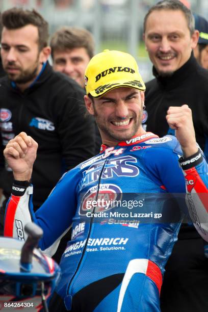 Mattia Pasini of Italy and Italtrans Racing Team celebrates the pole position at the end of the Moto2 qualifying practice during qualifying for the...