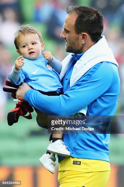 Goal Keeper Eugene Galekovic of the City enters the arena with his son during the round three A-League match between Melbourne City and the...
