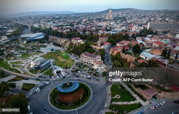 This picture taken using a drone on August 23, 2017 shows an aerial view of the Georgian capital of Tbilisi. / AFP PHOTO / Vano Shlamov