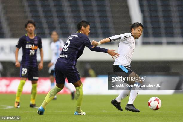 Yu Kobayashi of Kawasaki Frontale controls the ball under pressure of Kazuhiko Chiba of Sanfrecce Hiroshima during the J.League J1 match between...
