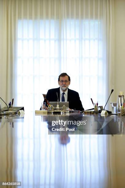Spanish Prime Minister Mariano Rajoy presides over an extraordinary meeting of the Council of Ministers at Moncloa Palace on October 21, 2017 in...