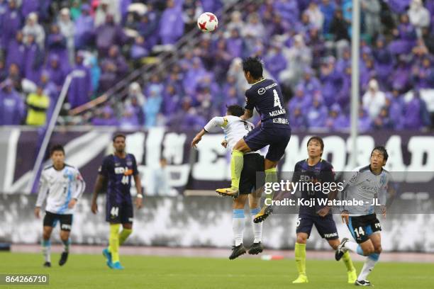 Hiroki Mizumoto of Sanfrecce Hiroshima and Yu Kobayashi of Kawasaki Frontale compete for the ball during the J.League J1 match between Sanfrecce...